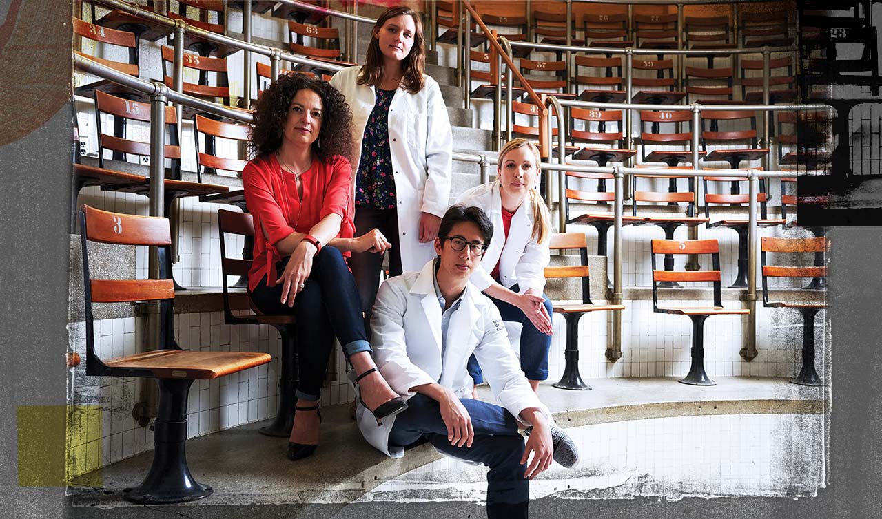 Photo of Susanna Rosi (left) and her team of postdocs, sitting in an old auditorium at Zuckerberg San Francisco General Hospital.