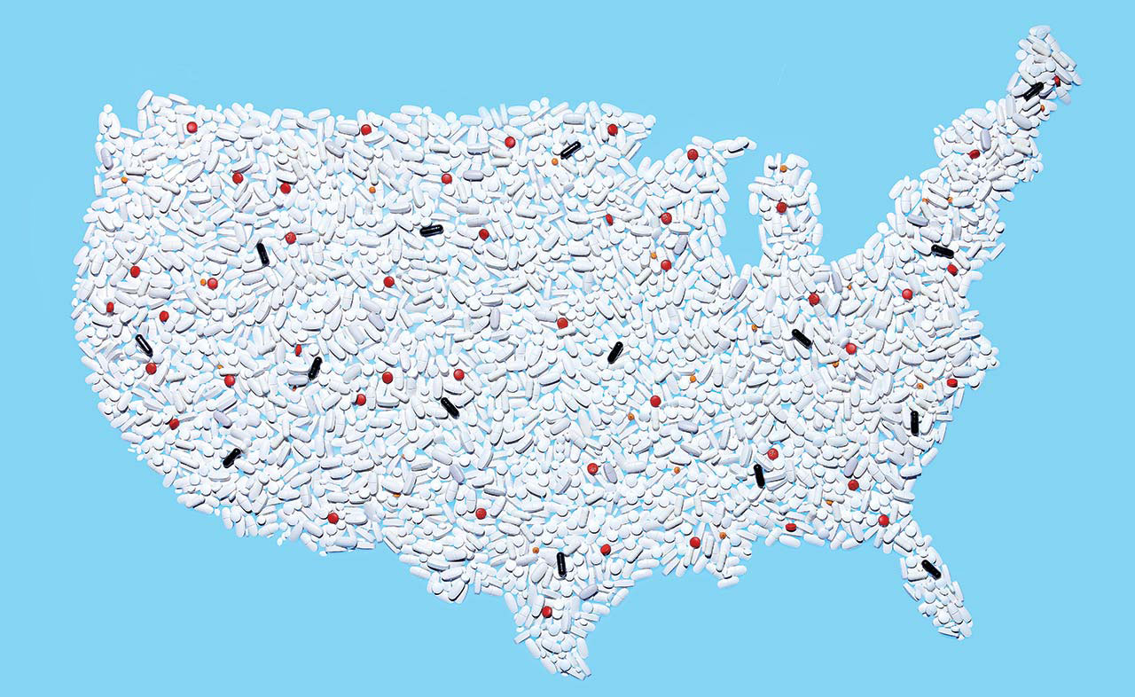 Photo illustration of a map of the United States, made out of pills; most of the pills are white, with only a few black and red pills.