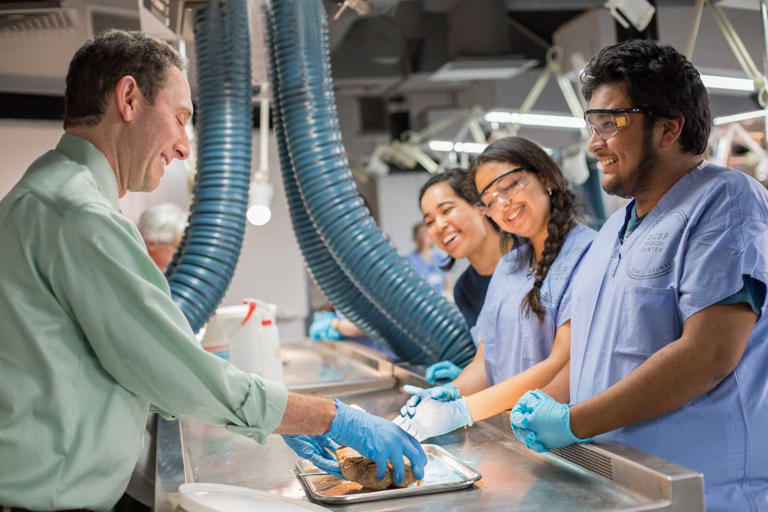 Andy Josephson teaches students in a lab about the hemispheres of the brain.
