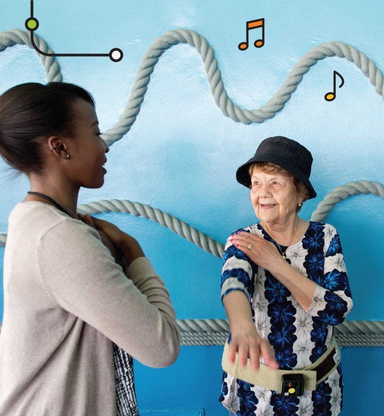 Choir coordinator, Dana Pounds (left), instructs Ruth Aviles (right).