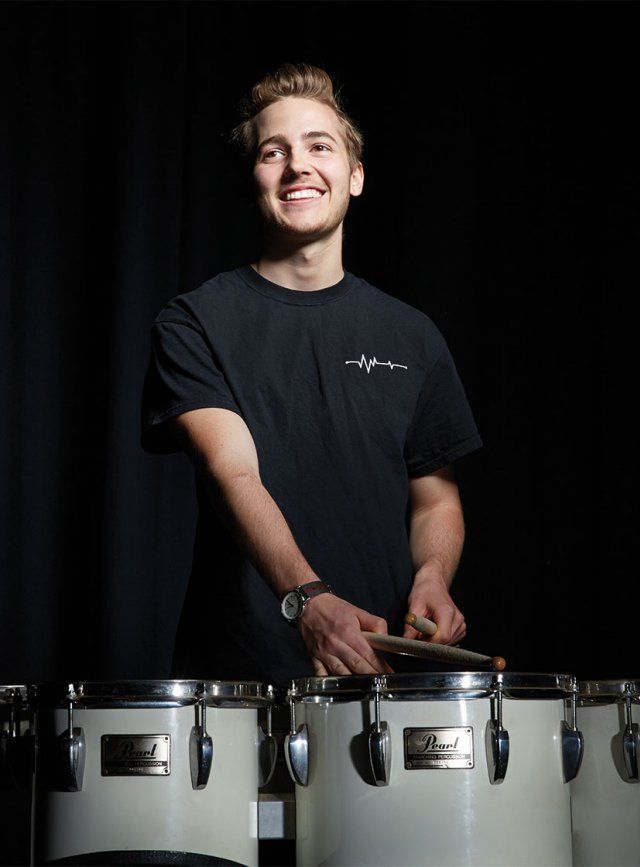 Oliver Bishop playing the drums.