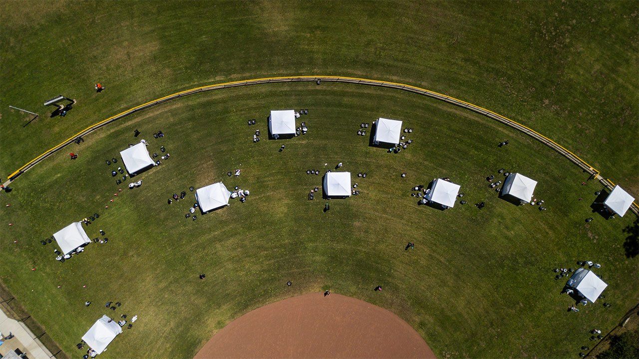 An aerial view of a baseball field with tests set up for a COVID-19 testing site in San Francisco’s Sunnydale neighborhood.