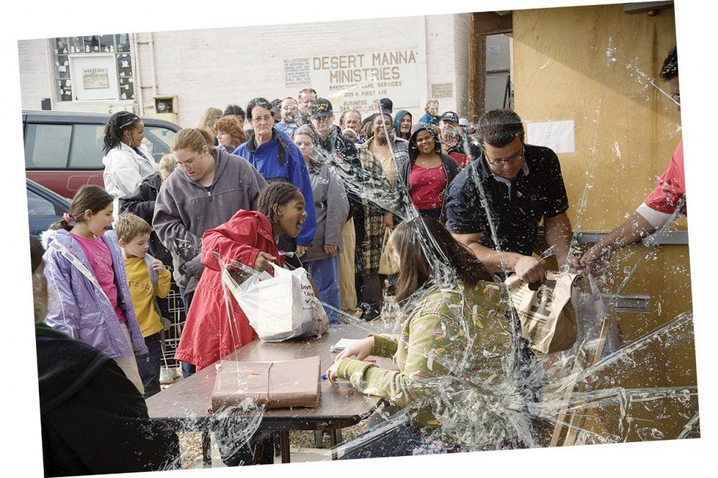 Photo of families receiving food from a food bank.