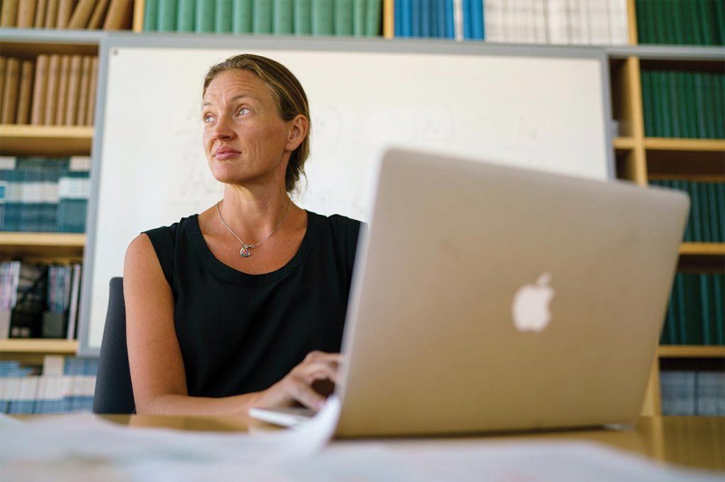 Photo of Rada Savic behind a laptop computer in a classroom.