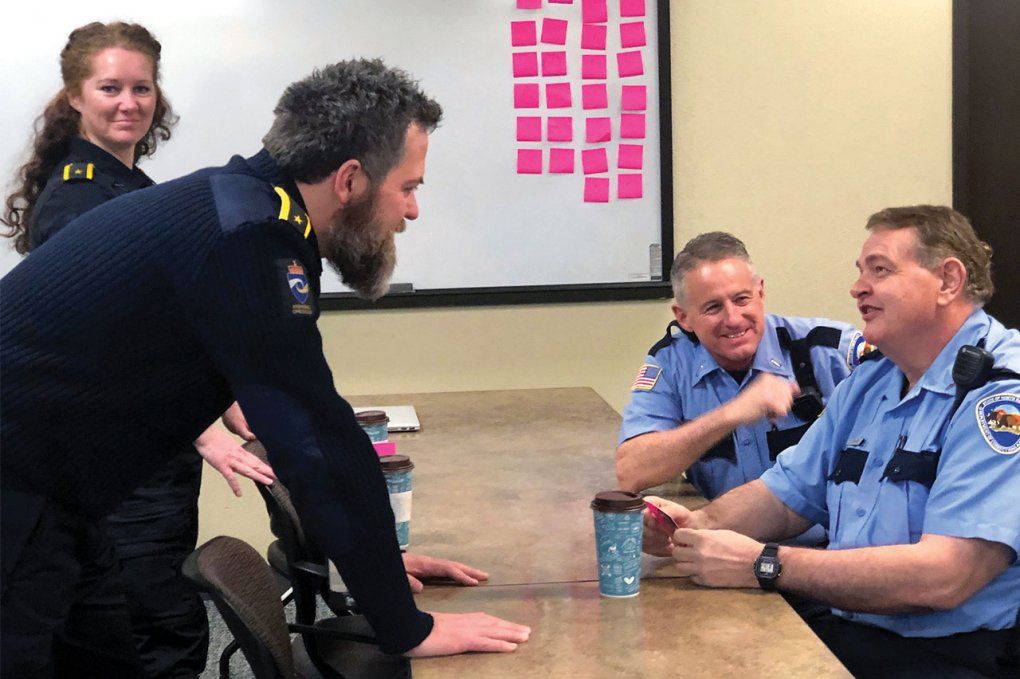 Photo of correctional officers from Norway talking with correctional officers from the United States, as part of UCSF’s Amend program.