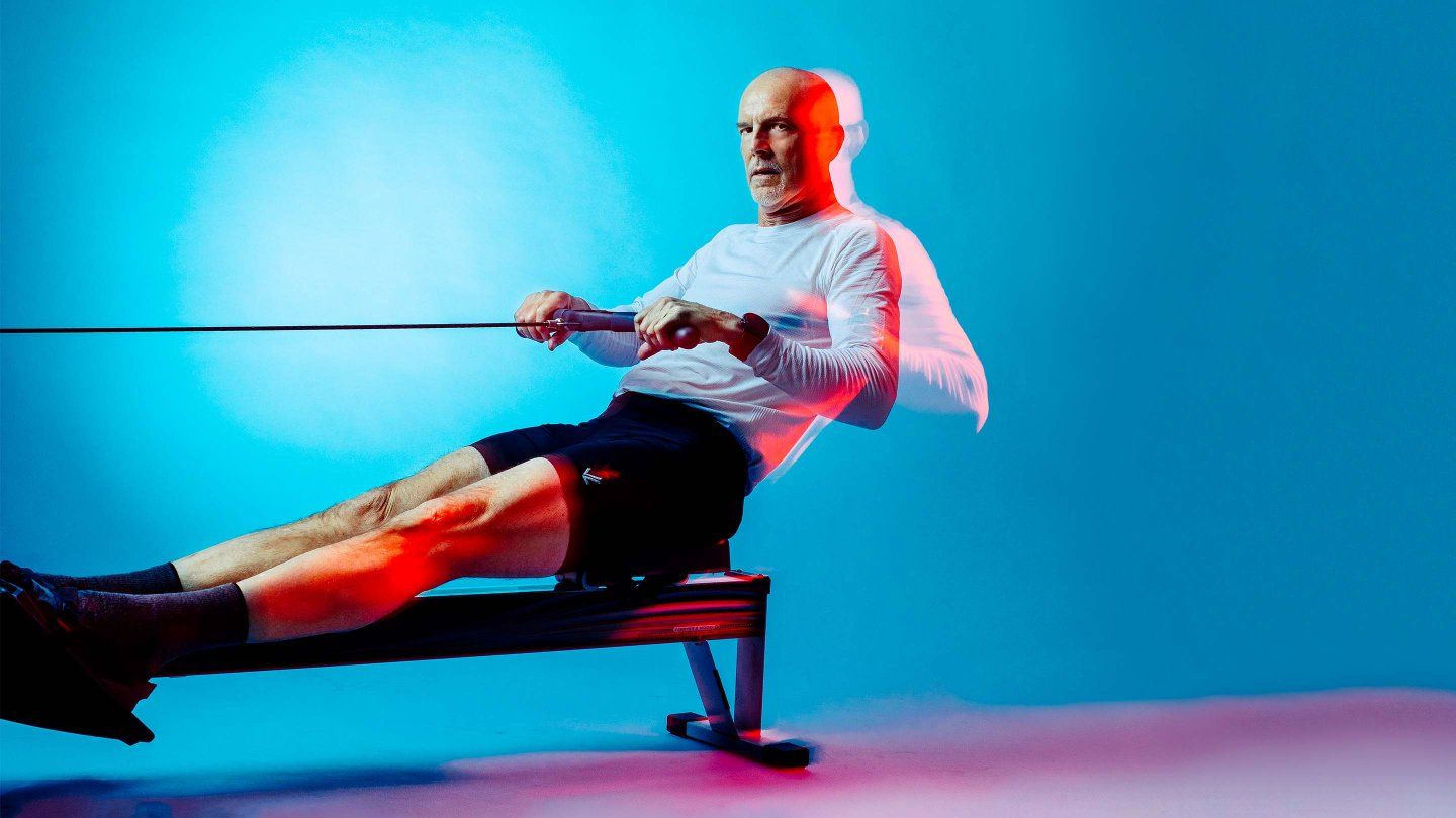 David DeRuff performs a rowing motion on an erg. 