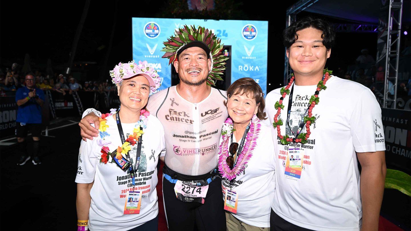 Jonathan Pascual stands with his wife, mother, and son after the race.