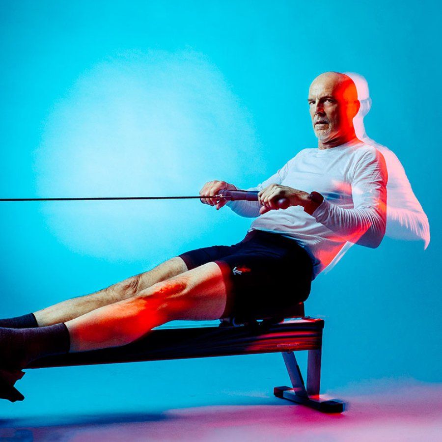 David DeRuff performs a rowing motion on an erg. 