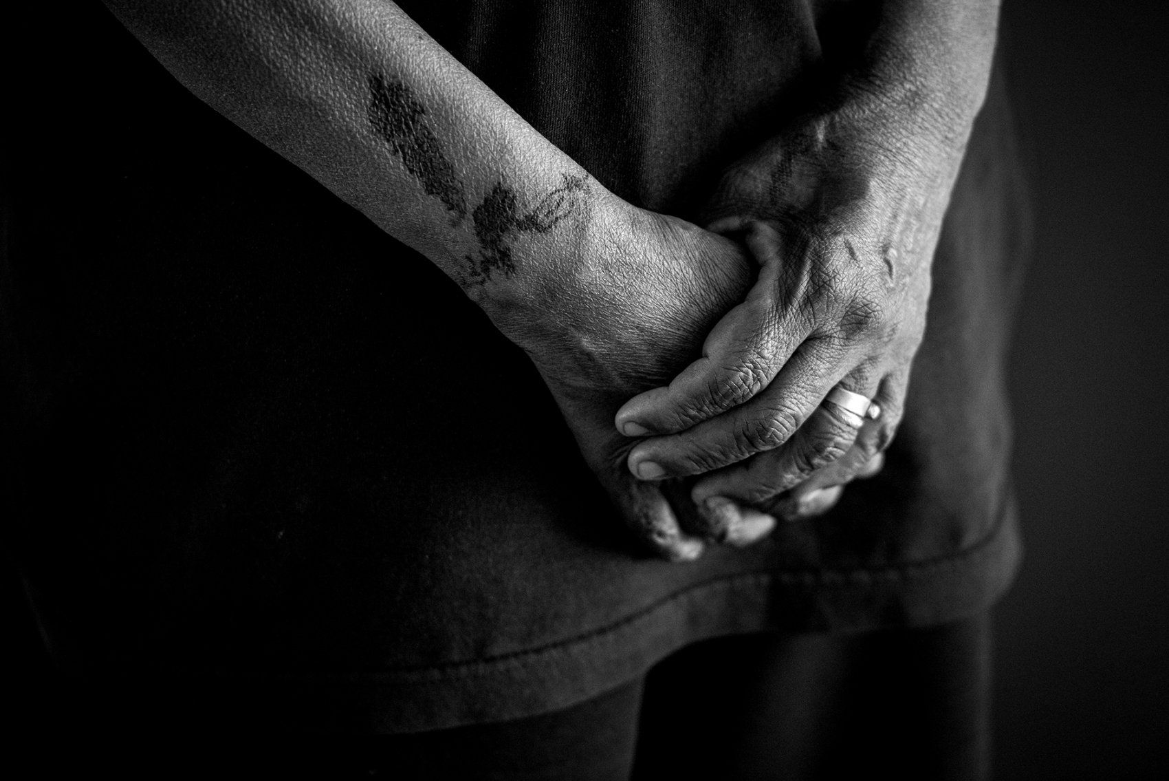 close-up of person's crossed hands