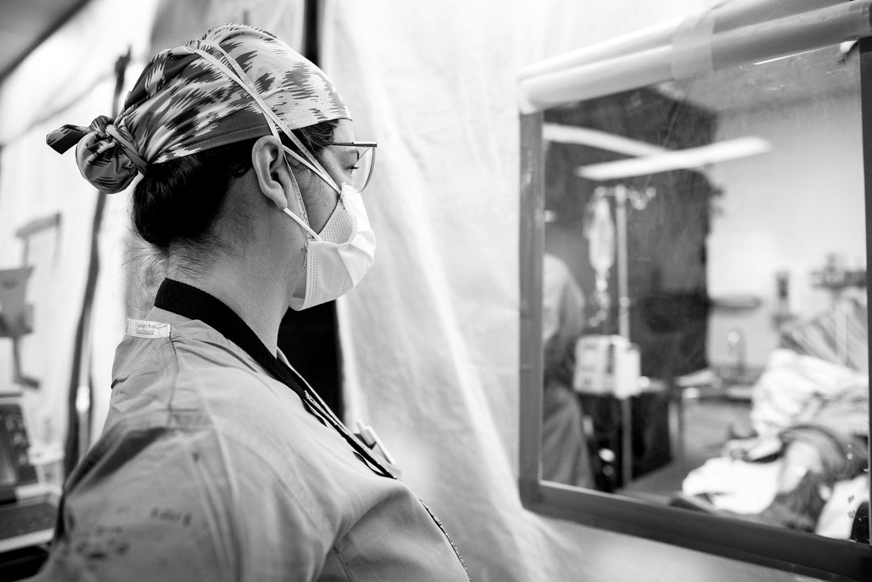 a nurse looks on to a triage area