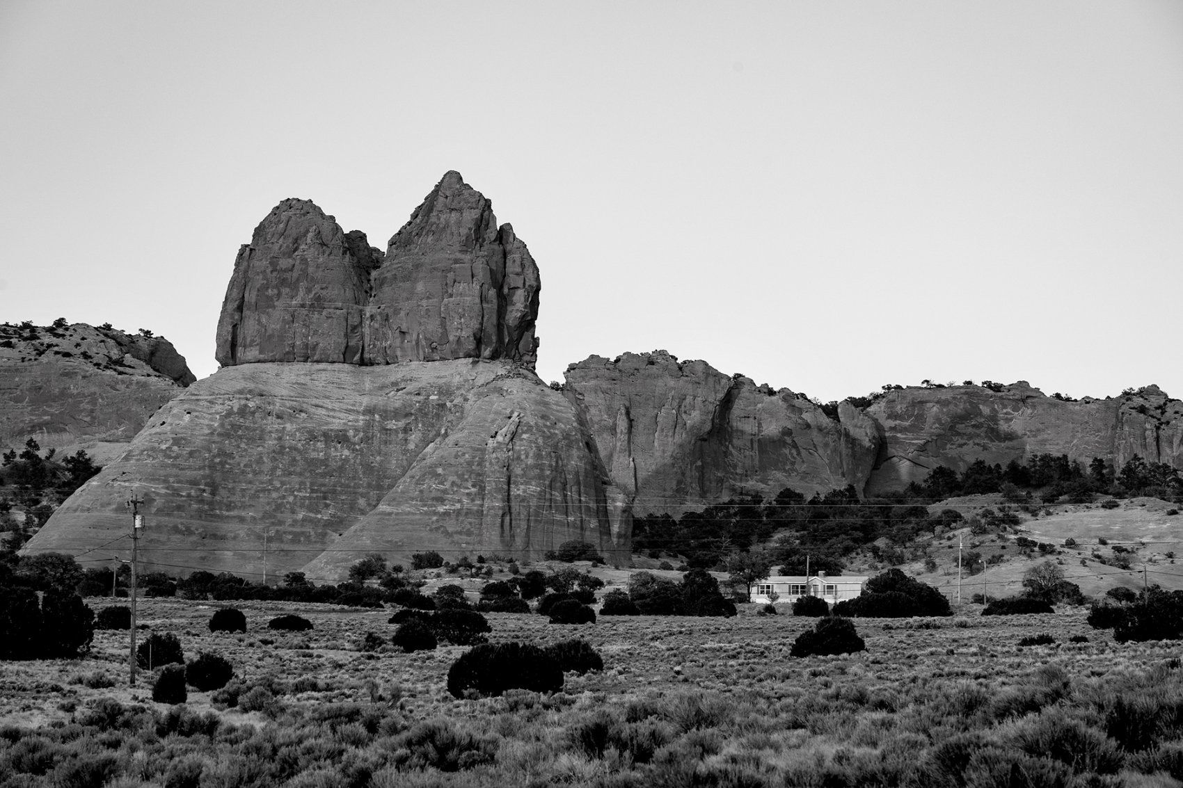 a house sits among rock formations