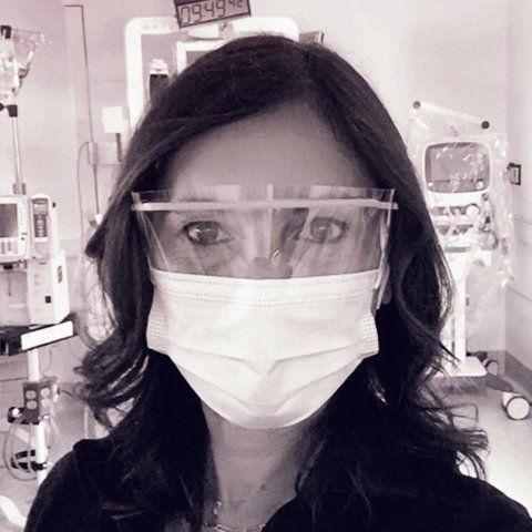 Portrait of Maria Raven in the ER, with surgical mask and eye goggles on.
