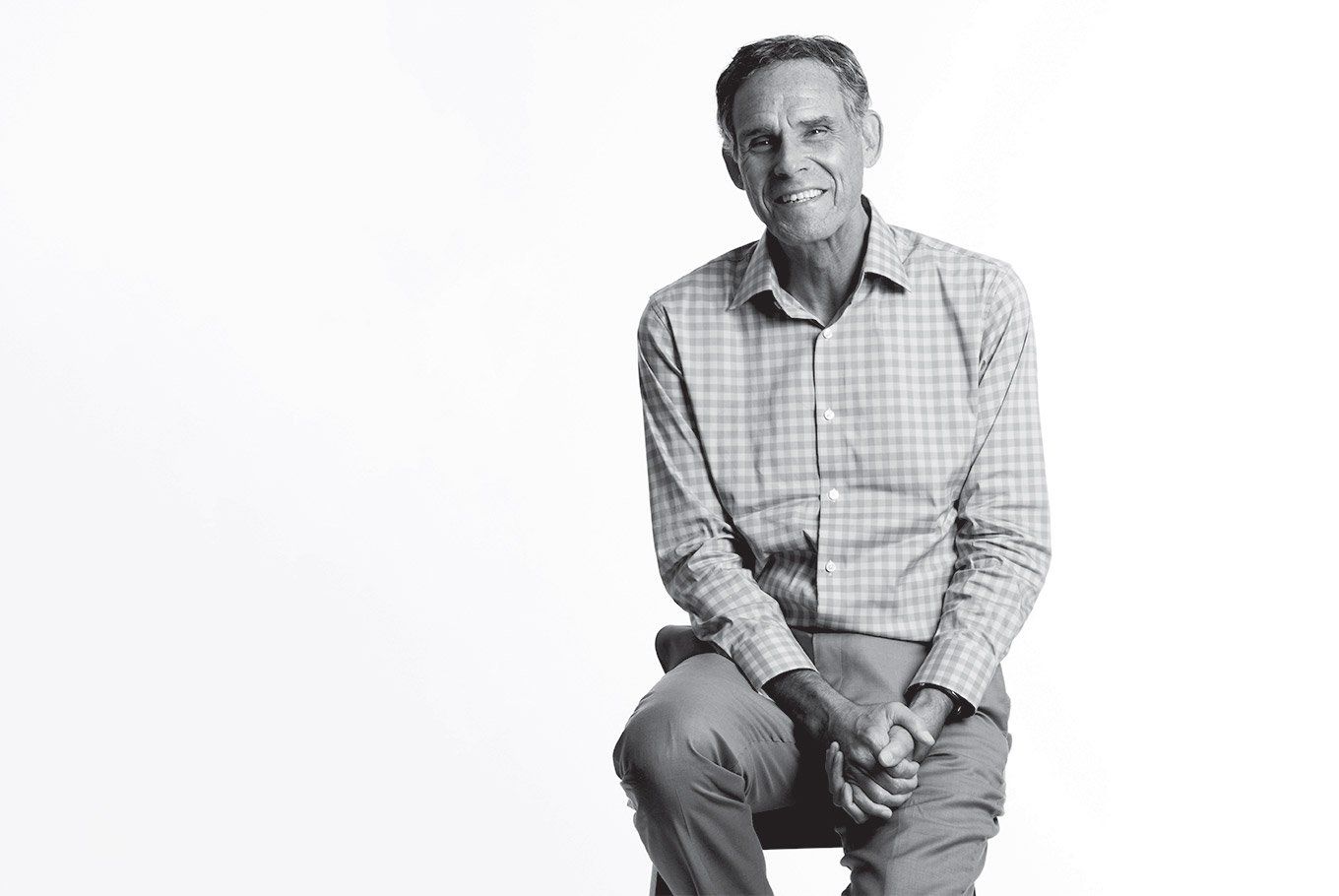 Portrait of Eric Topol, MD, in front of a white background.