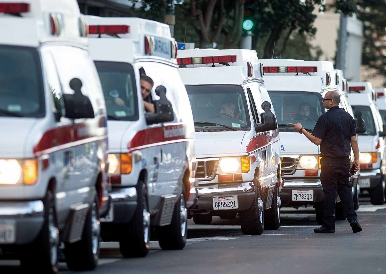 A line of ambulances ready to transport patients to the new UCSF Mission Bay hospitals.