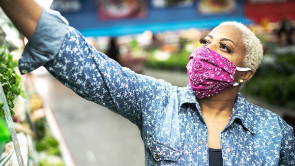 Woman wearing a cloth face mask in a grocery store