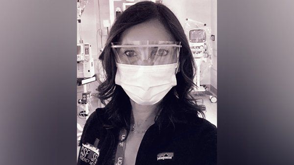 Portrait of Maria Raven in the ER, with surgical mask and eye goggles on.