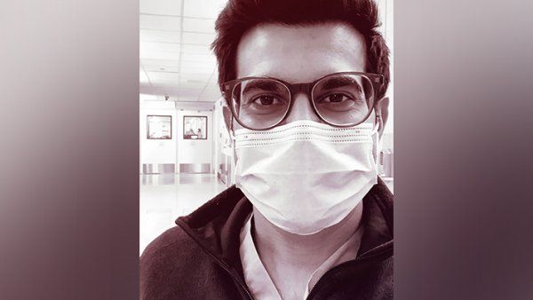 Portrait of Sajan Patel wearing a face mask in the hospital.