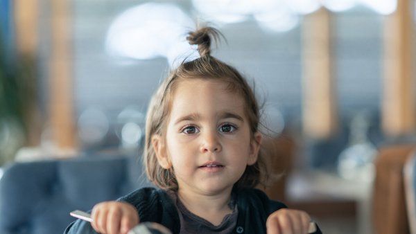 Young child with empty plate