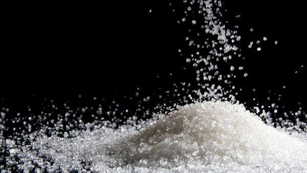 Photo of a pile of white sugar.