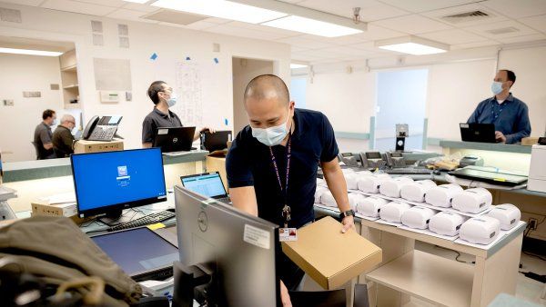 workers set up computers