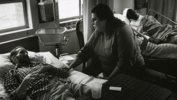 Deb Gumbley checks on a patient in the SFGH AIDS ward