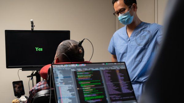 Man using neural prosthesis to translate his thoughts into words on a screen when prompted