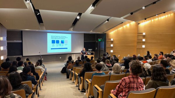 A lecture room is filled with attendees listening to Dr. D'Anne Duncan present the 2022 UCSF Last Lecture.