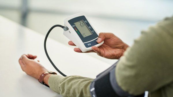 A man checking his blood pressure with a home blood pressure test