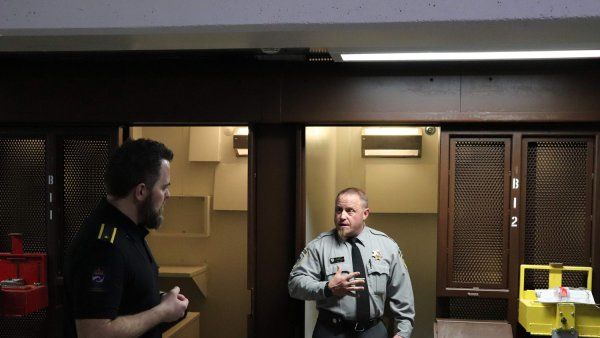 Oregon State Penitentiary officer Dave, right, talks with a trainer from the Norwegian Correctional Service in a prison.