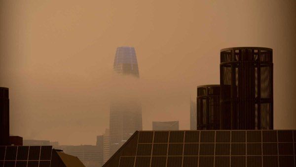 Thick, orange clouds of smoke from wildfires blanket downtown San Francisco in 2020.