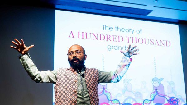 Postdoc Slam 2025 first place winner Atreya Dey delivers his talk on stage.