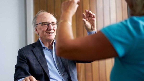 Bruce Miller conducts coordination exams on a patient.