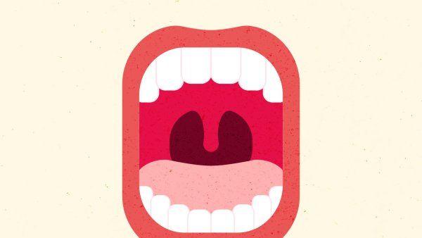 Bold illustration of an open mouth with teeth and tongue.