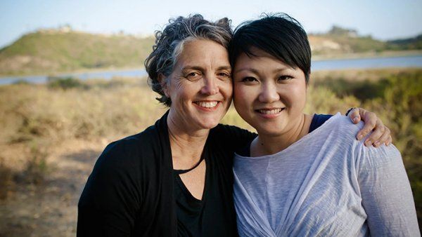 Jessie Mahoney and Ni-Cheng Liang embrace each other.