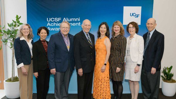A group photo of the eight 2026 Alumni Achievement Award winners.