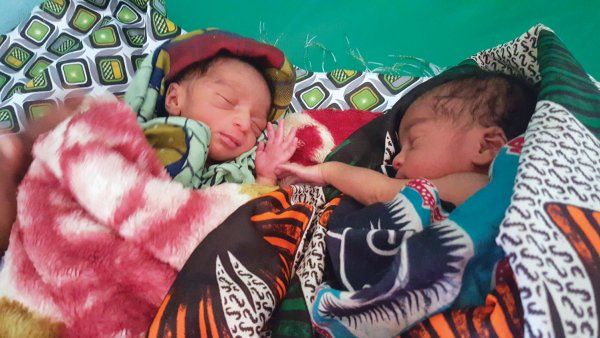 Two newborn babies wrapped up in blankets in Malawi.
