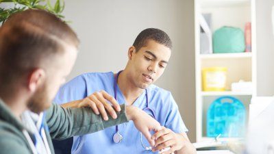 male_nurse_with_patient.jpg