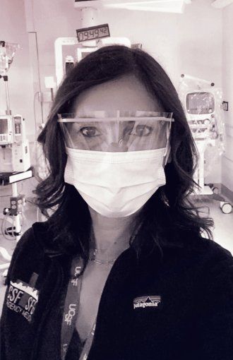 Portrait of Maria Raven in the ER, with surgical mask and eye goggles on.