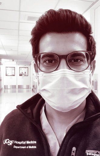 Portrait of Sajan Patel wearing a face mask in the hospital.