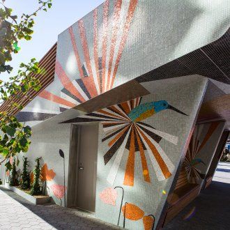 Bay Area-based artist Clare Rojas designed the public amphitheater in front of the UCSF Medical Center at Mission Bay with a mosaic of vivid, geometric shapes featuring hummingbirds