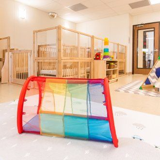 A rainbow colored tunnel that an infant can crawl through