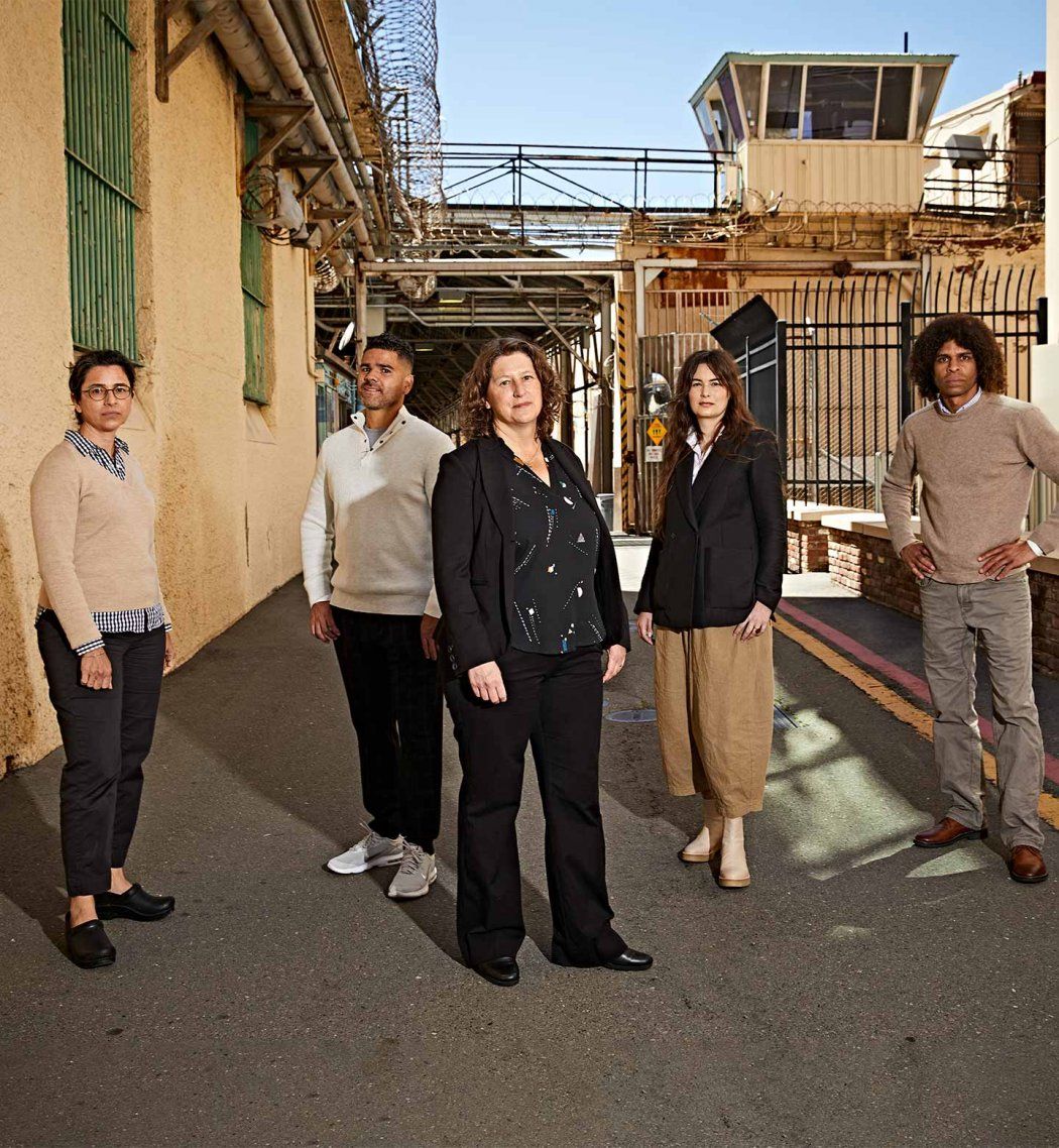 Photo of Amend director Brie Williams, MD (center), with San Quentin State Prison medical chief Alison Pachynski, MD ’02 (left), and Amend team members Fernando Murillo, Michele Casadei, and Daryl Norcott, JD.