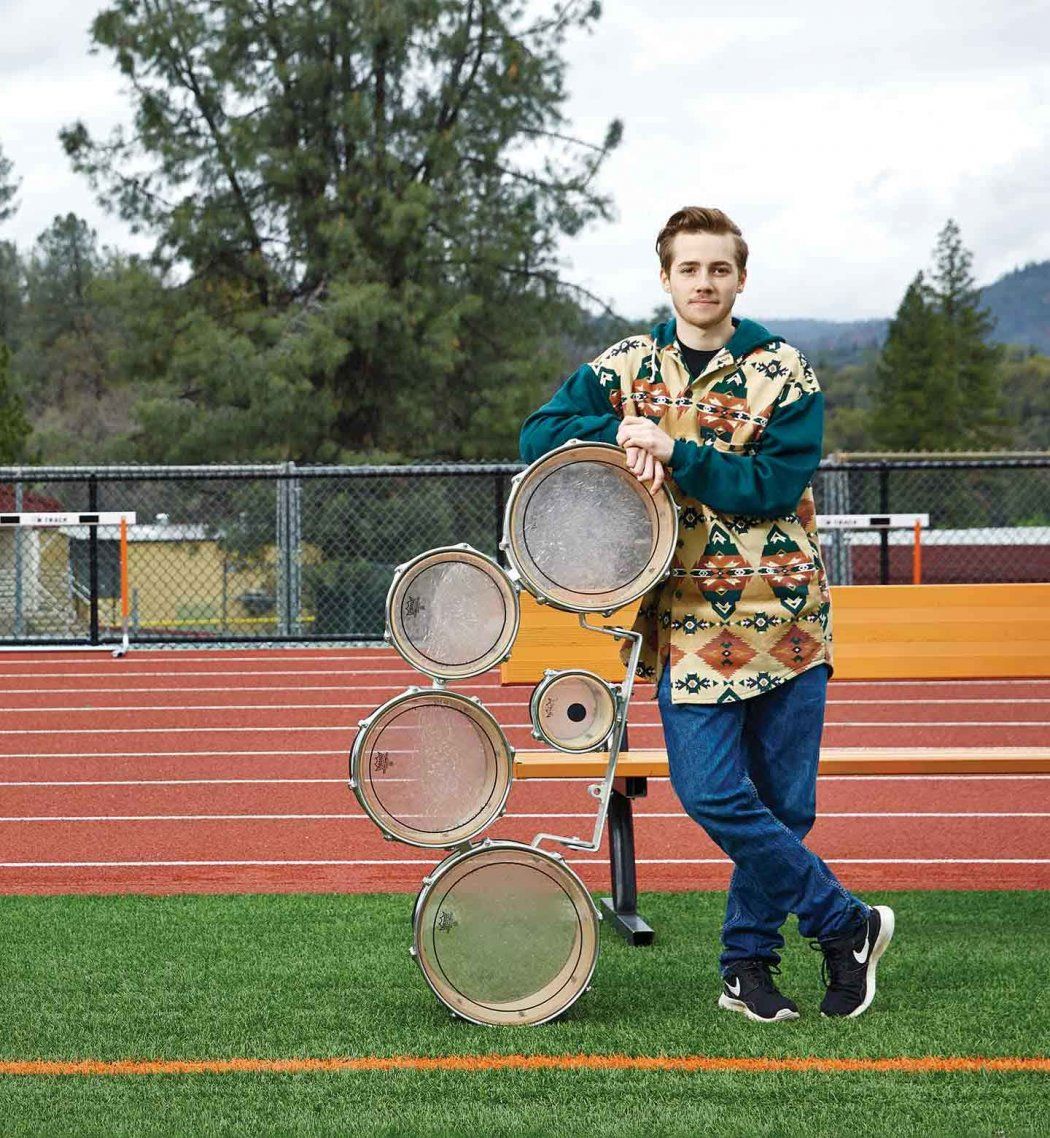 Oliver Bishop with drumline equipment at his high school.