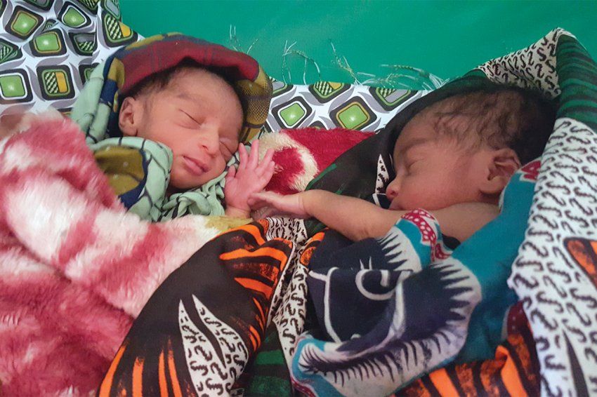 Photo of two newborn babies wrapped up in blankets in Malawi.